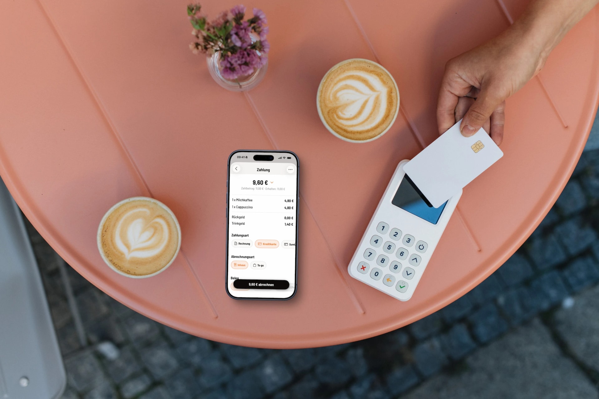 Guest paying contactless on an iPhone with Servire Tap to Pay in a coffee shop
