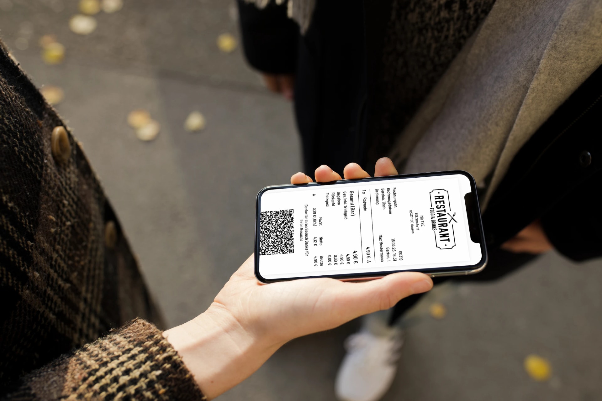 Servire POS app on iPhone in hand